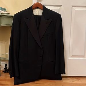 Luciano Barbera black three piece tuxedo.